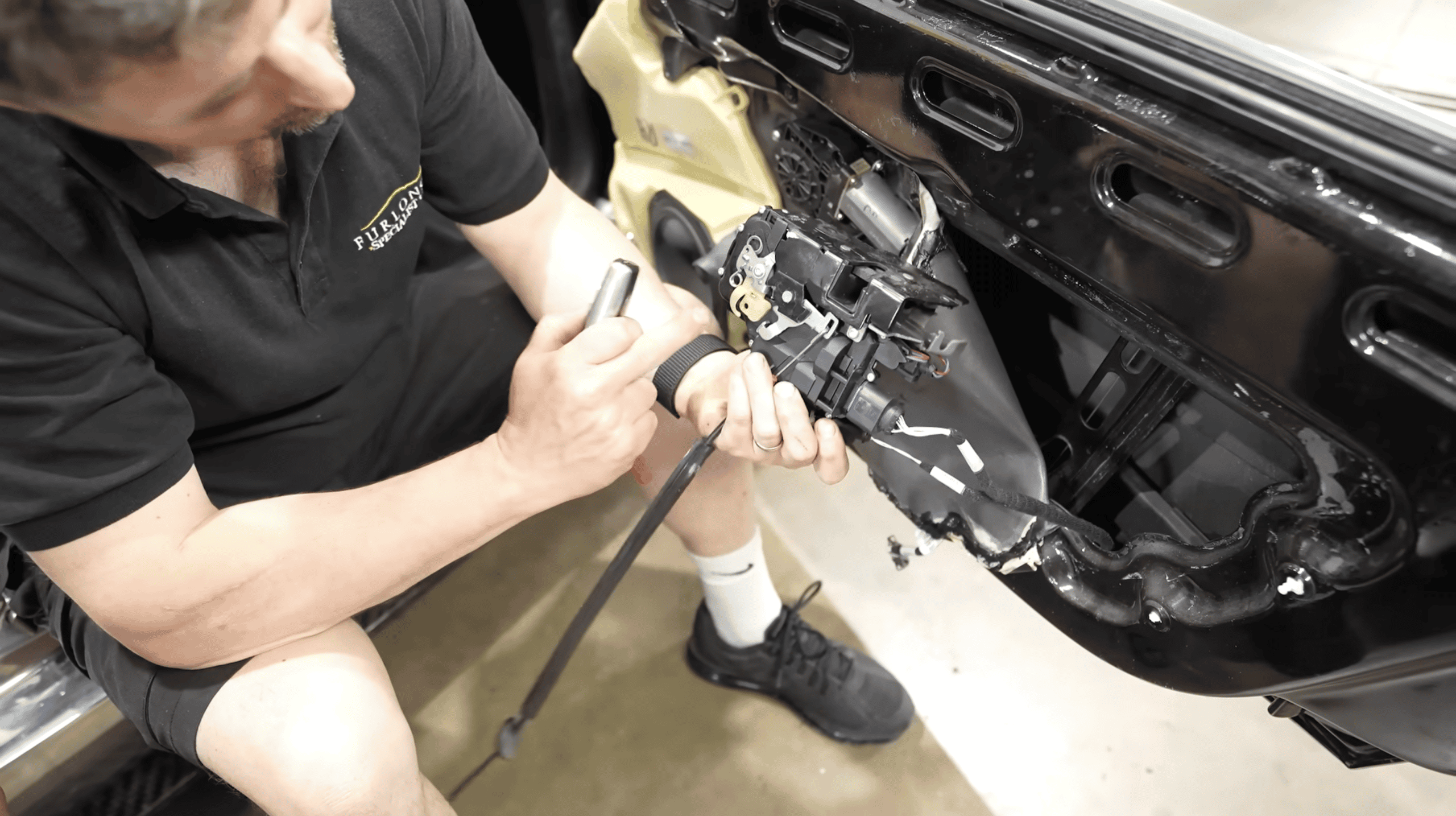 Fixing the broken door handle on Mark McCann's Bugatti Veyron